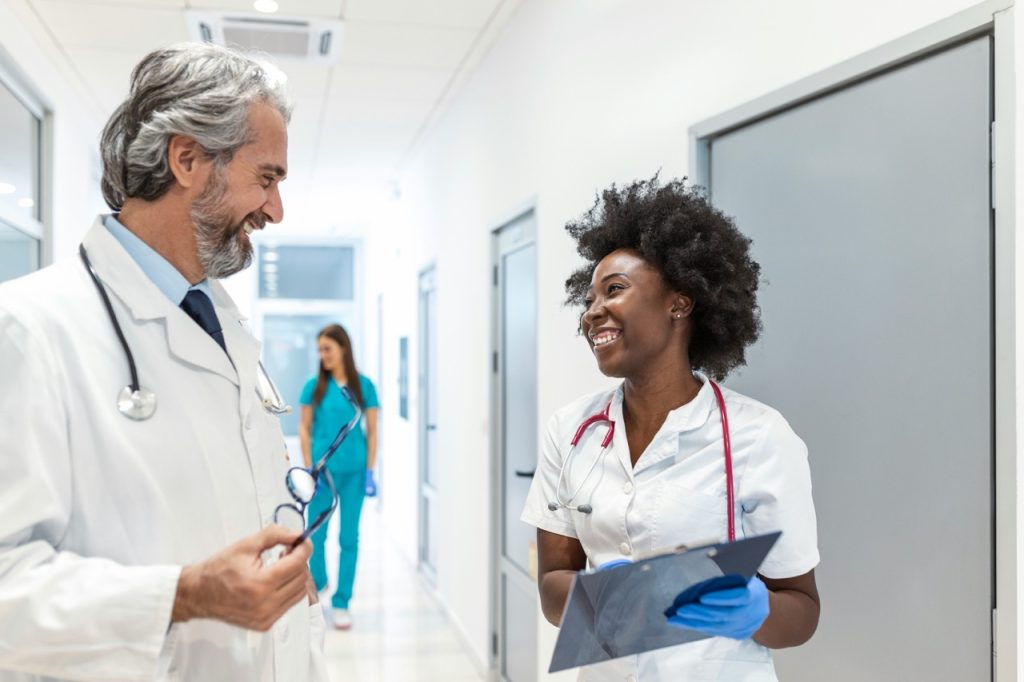 Healthcare Professionals consulting in hallway